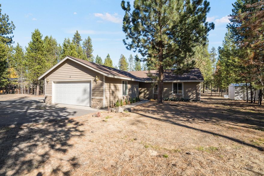 Enjoy the tranquility and privacy of this single-level home situated on almost one acre, backing to over 19 acres of natural open space. The property offers a peaceful setting surrounded by nature while remaining close to lakes, rivers, Mt. Bachelor, Sunriver, and endless outdoor recreation.
The home features 3 bedrooms and 2 full baths, a convenient laundry room, and a spacious pantry. A large sunroom brings in an abundance of natural light and provides a great spot to relax or enjoy your morning coffee while taking in the views.
Outside, you'll find a fenced area ideal for pets or play, plus a playhouse and storage shed for your outdoor gear. The entire property is fenced and includes gated access, an oversized two-car garage, paved driveway, and RV parking with full hookups—perfect for your Central Oregon adventures.
With its excellent location and beautiful natural surroundings, this property is ready for your personal touches and updates to make it truly shine