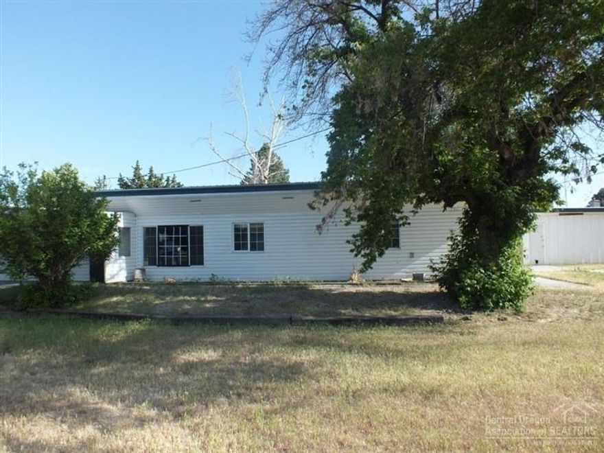 This home is located in a great neighborhood. The large backyard is fully fenced, and even includes a cool treehouse. The detached garage is accessible from the alley, and there is a double carport in front of the house. The interior was just completely repainted, and a new carpet was installed. The floor plan is very open, and two of the bedrooms feature large walk in closets. This is a Fannie Mae Homepath property.
