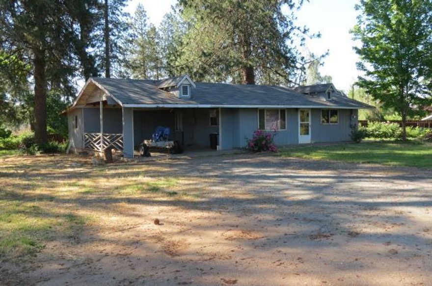 Cute Ranch Style home in Jerome Prairie area. This 2 Bedroom, 1 Bath 768 sq ft Home was Built in 1973, and features a Big Kitchen with Plenty of Storage, and an Eating Bar. It also has a Covered Back Patio, 2 Car Attached Car Port, with a Large Bonus/Storage Room at the rear of the Car Port. This Home is on a Large .73 Acre Lot which has Irrigation Rights with Grants Pass Irrigation District so you have room for a Big Vegetable Garden as well as Outdoor Entertaining. Come enjoy Country Living, just a few minutes from town.