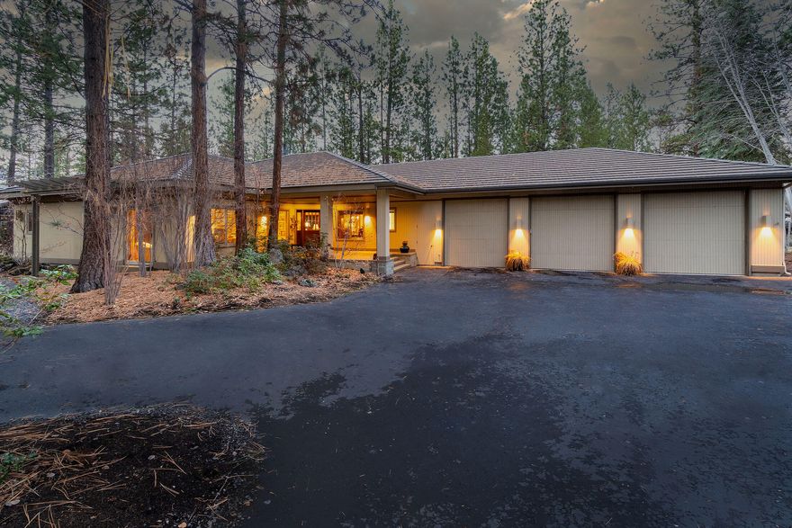 Lovely single-level Broken Top home tucked among the pines on a large .69 acre lot, privately situated at the end of cul-de-sac and featuring an exceptionally rare RV garage.  Sun Forest Construction's impeccable craftsmanship is found throughout this Northwest Contemporary residence, from the wood-clad facade to the natural elements on display across the interior. Expanses of glass beautifully blend with the serene outdoor setting while bathing every space in radiant sunlight creating the relaxed feeling of being comfortably at home.  Gather in the great room where vaulted ceilings overhead are anchored by a stately, wood-burning fireplace, and large glass sliders lead to the expansive deck, providing refreshing views. Adjacent formal dining area is accented by coffered ceilings above and the gourmet kitchen is equipped with high quality appliances, an island with a prep sink, pantry and an adjacent breakfast nook.  elegant primary suite, a serene guest room & stately office.