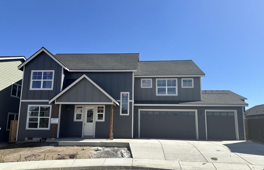 This three-car garage home is in the new neighborhood of Stevens Ranch, Bend. You will love the beautiful quartz countertops and stainless-steel appliances. The main level is open concept living with an office. On the upper level, you will find four more bedrooms. The primary suite has a walk-in closet, a large tile shower, and dual vanities. The home is Earth Advantage certified and includes a landscaped front and back yard, fencing, a Ring doorbell, a Nest thermostat, a 220-volt plug for an electric car, and air conditioning. You have everything you need to make it the perfect home. Stevens Ranch features parks, caves, walking paths, and nearby shopping and restaurants.