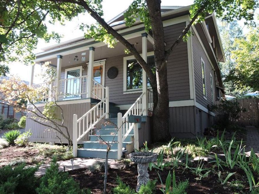 Close-in Ashland Historic Beauty! This lovingly updated, 1900-built home combines the best of modern amenities with comfortable classic charm, all just steps from Shakespeare and the heart of downtown Ashland! Inside is a relaxing, comfortable floor plan with custom-crafted woodwork throughout, open living/dining and a chef's kitchen with Italian slab granite counters, great storage and expansive eating bar, family room, main-level office/bedroom, upper level master suite with walk-in and lovely woodwork. The quarter acre lot a true sanctuary--beautiful landscaping, lovely deck and arbor, heated in-ground pool, hot tub, outdoor shower, mudroom, soaring mature trees--and with R-2 zoning and alley access, it may accommodate guest quarters or separate dwelling. You also get a finished double garage, RV parking, newer roof, skylight and easy access to all the best that Ashland has to offer. Don't miss it!