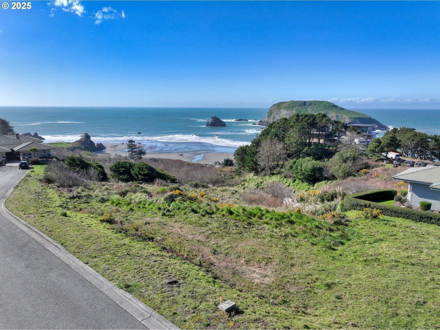 Wake up to the sound of the surf and end your days with sunsets over the Pacific — this beautiful lot offers front-row access to Oregon's coastal charm. Just steps from Harris State Beach Park, you'll enjoy panoramic views and direct proximity to one of the area's most beloved natural spots. With deeded beach access just down the road, ocean adventures are always within reach. Located in a sought-after neighborhood surrounded by well-kept, newer homes, this southern-facing lot is ready for your dream build. Approved architectural plans and a completed geology report are included to simplify your path to construction. Utilities are at the property line — buyer to confirm with city and providers. Opportunities like this don't come around often!