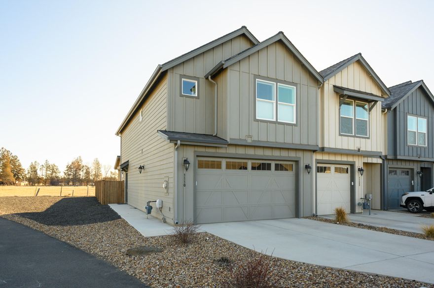 By far the best living you can get in Redmond for under $400k! High quality finishes throughout this spacious and functional 3 bed/2.5 Bath townhome in one of Redmond's best located neighborhoods--with schools, playgrounds, the Dry Canyon trails and downtown all within easy reach. An end unit townhome with a two car garage providing room for your toys, cars or storage. The corner lot at the end of a dead end street gives more privacy and parking options than one would normally expect. On the interior of the home, you will find light and bright tones, quartz countertops throughout the kitchen and bathrooms, LVP flooring, immaculate carpets and plenty of storage (large pantry and linen closet). The primary suite has a 5 peak Cascade Mt. view, a giant walk-in closet and a dual vanity bathroom. All top quality appliances (yes it's got A/C + Wave Air Purifier & a tankless water heater) are included with purchase. The fenced backyard is fully landscaped with automatic sprinklers.