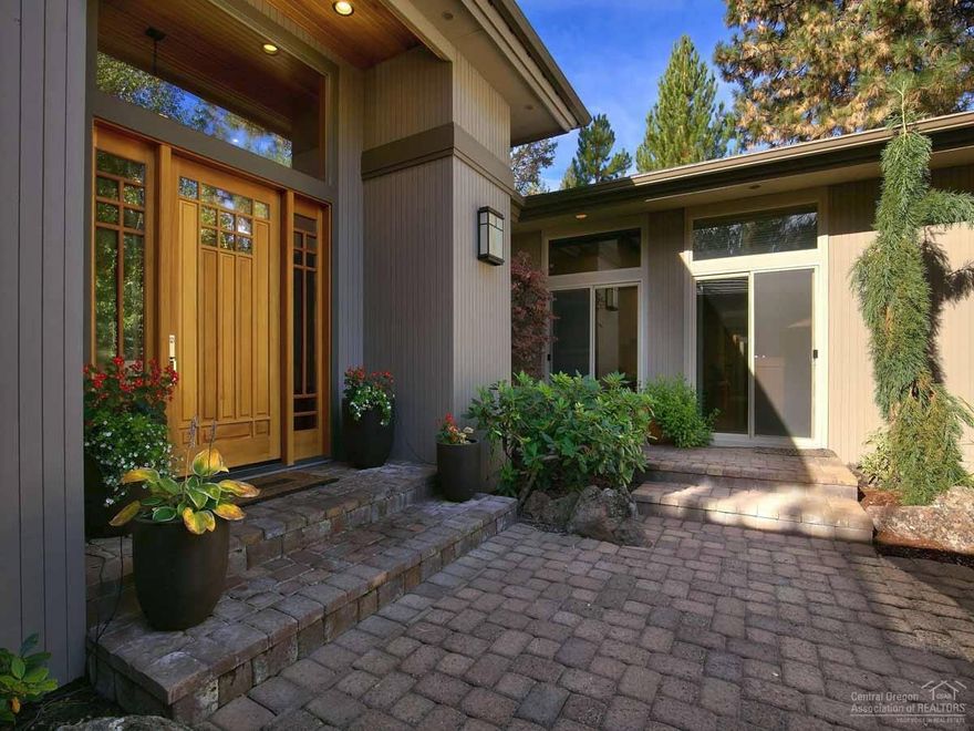 Exquisite single level Norman Building and Design home that is timeless in quality and finishing touches. This home is ideal for entertaining. It features an open floor plan with vaulted ceilings and two gas fireplaces, a luxurious master suite, two en-suite bedrooms, an office and flex room - all with sliding doors to the outside. Private courtyard with a sunken hot tub for year-round outdoor space. All on a beautifully landscaped .32-acre lot in Broken Top.