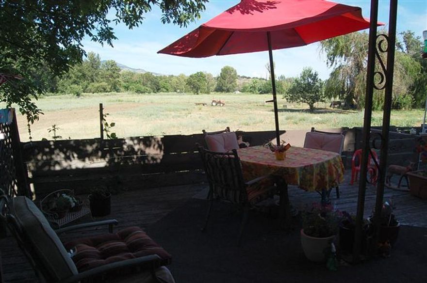 Pride of ownership shows in this attractive home located in Green Way Village 55+ community. The home is on one of the largest lots and looks out over the neighboring pasture. The deck on the front of the home is huge and features a garden area on the far side of the deck. The yard is fenced for privacy. The home is in excellent condition. The kitchen and dining area are open to the living room and the home features a nice split floor plan. Plus a storage shed under the carport.