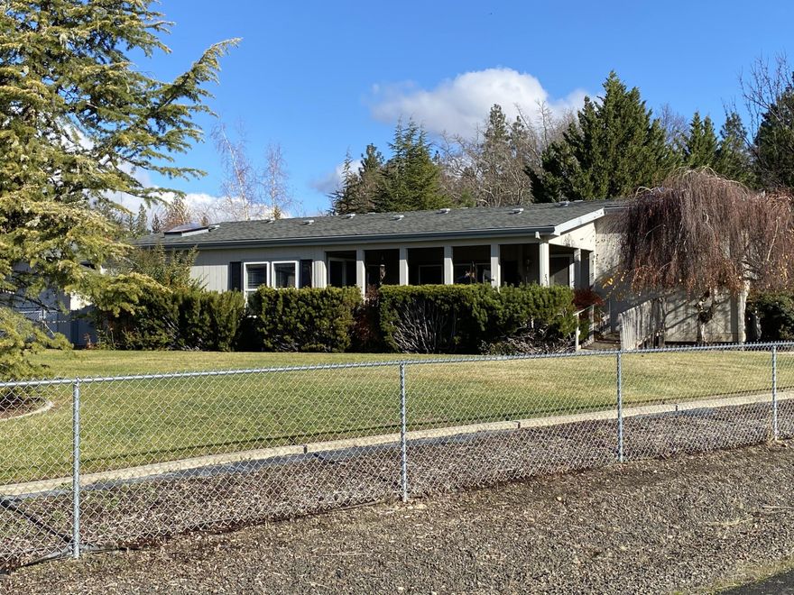 Nestled in the wonderful community of Shady Cove this 1997 built triple-wide on a .48 acre lot is ready for its new owner!  Deer Park Estates is a nicely maintained subdivision just a short distance to Rogue River recreation!  Large covered front porch entry.  Vaulted living room with ceiling fan.  Spacious kitchen offers skylight, eating bar, excellent cabinet storage, dishwasher, smooth cooktop range/oven, and eating bar.  Informal and formal dining areas.  Large master suite has sit-down vanity and walk-in closet with built-in shelves.  Covered back patio.  Covered breezeway to detached 2-car garage. Plenty of RV parking space.  New duct work installed.  Move-in ready!