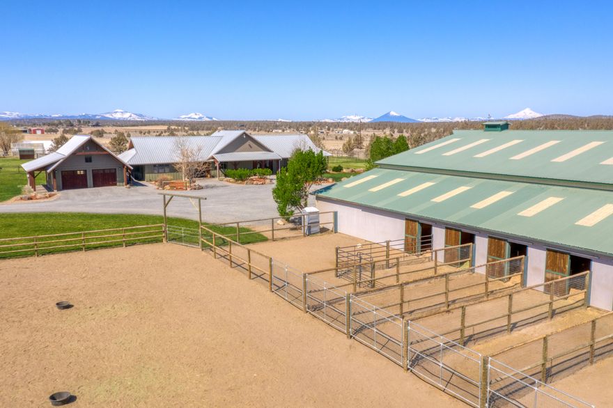 BEAUTIFUL GATED 19.54 ACRES EQUINE PARADISE w/Cascade Mountain Views! 
Everything you need for a Horse Lover.Amazing indoor training & showing arena w/dustless Pro-Tex (textile/sand/rubber) footing, lights, wash rack w/hot water, tack room & paver breezeway. 6 stalls w/6' no-climb wrapped fencing, Nelson/Richie  waterers & w2w rubber mats. 2 hay producing pastures w/75 gal per min acre allotment into irrigation pond w/high eff timed sprinkler system allowing much more irrigation coverage of property. Pastures have H2O & Electricity. DIRECT RIDE OFF to to 1000's of acres of BLM & Maston trail head. Stunning custom timber beam ranch home w/3031 sq ft. Entertainers dream w/dramatic wood beams & floor to ceiling stone wood FP. Open floor plan, gorgeous wood & slate floors, solid granite counters & SS Dacor appliances. Lrg pantry & plenty of storage. 3 large bdrms & 2.5 baths. Huge heated shop w/private archery range,storage galore,covered equipment/hay storage. PURE PERFECTION!