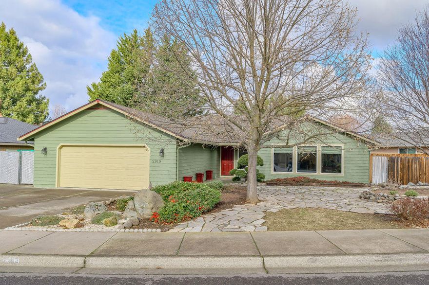 This home is an absolute gem! Clean as a whistle with tons of upgrades, a tasteful layout, 10 x 54 RV parking, and it's situated in a wonderful E Medford location! Pride of ownership is obvious from the moment you park the car with clean, low maintenance landscaping, fresh exterior paint (2016), and a new 40 year roof with transferable warranty (2019). The backyard was upgraded to turf for easy care and low water consumption, and you'll love relaxing or entertaining on the covered composite deck. Once inside you'll enjoy a comfortable single level layout with separate great room and vaulted living room, new vinyl plank flooring in most of the home (2020), vinyl windows (2016), refinished cabinets, custom master bath with extensive tile, a certified woodstove insert and more. In addition, the main water line and house were replumbed (2015, 2020), there's a new A/C condenser and furnace upgrade (2019), and a new water heater (2019). The heavy lifting is done, just move in and enjoy!