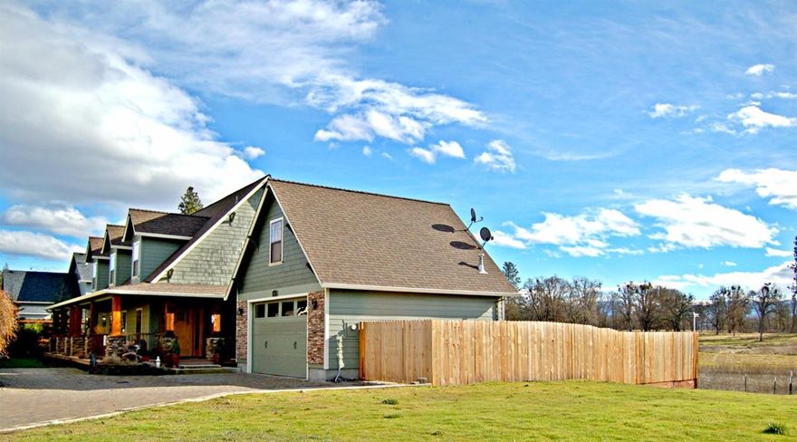 This beautiful custom home is located in the Echoes of the Ponderosa, and across the street from the city park. As you enter into the open, spacious living area, you can't help but notice the pasture land through the large windows. You won't believe you are still in a subdivision! The roomy kitchen is open to the living area and has a large pantry. The huge master suite is located on the main floor and has a romantic fireplace, & private deck access with more of those incredible views. The master bath has a jetted tub, separate shower, heated floors, and huge walk-in closet. Upstairs you'll find 3 gigantic bedrooms with walk-in closets. The garage has built-in shelving, plus a 260 square foot bonus room upstairs. There are so many upgrades in this home; from the built-in surround sound, to the dry-bar with an ice fridge, to the light up pavers in the cobblestone driveway! This home is a must tour!