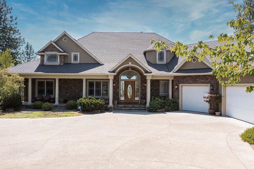 Experience this luxurious masterpiece on a private, park like setting. A paved entry leads to this stunning 5 bed, 5 bath, 5,652 sqft home that includes several gathering spaces, four patios, a formal dining room and breakfast nook, large kitchen island, and even a movie theatre! Stunning mountain views can be seen from all rooms, and the two outdoor water features make this quiet property feel like an oasis. Upstairs is the spacious and elegant master bedroom, a sunroom and exquisite chef's kitchen; head down the grand staircase and you will find the movie theatre, bar, large rec room, two covered patios and three additional bedrooms. The amenities continue with the three car attached garage, extra parking, raised garden beds and expansive storage throughout the home. This is truly a must see to fully experience the stunning views, impressive craftsmanship and all around beauty and all of this is just minutes to town!