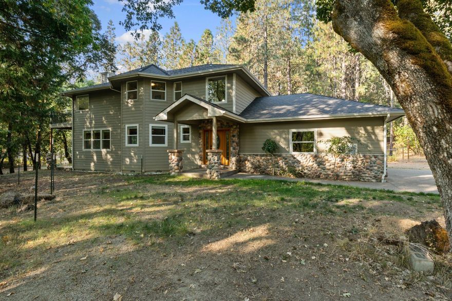 Luxurious Executive Custom-Built Home –Feels and Looks Like New!  Just minutes from both the Rogue and Applegate Rivers this home sits on almost a full acre in a tranquil woods-like setting though it is still only minutes from downtown and the highway. The home boasts 3 bedrooms and 3 full baths along with downstairs office/den with french doors that could be a 4th bedroom. There is also a grand canning/storage pantry and a full laundry room with its own sink The home has tall open ceilings and feels larger than expected.  The large master suite is upstairs with a big walk-in closet, ensuite bathroom and soaking tub with its own private balcony in the trees. The house is set back off the road and looking out every window you will see picturesque landscape and views of nature. Seasonal creek runs through creating a relaxing atmosphere and nearby wildlife.