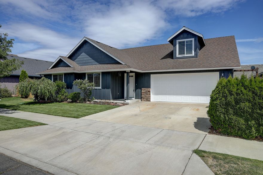 This beautifully maintained, single-level living home will not be around long.  Turn key and recently renovated with new paint inside and out, as well as a new AC installed this year.  Pride of ownership shows throughout from the dark green lawn to the water feature in the back, fenced and ready for your backyard entertaining.  The home boasts a slate entry, laminate flooring on the first level, bonus/media room on second level, slate surround fireplace, ceiling fans, and vaulted living room.  Hard to beat location in Redmond while surrounded by new homes, parks, and walking trails.