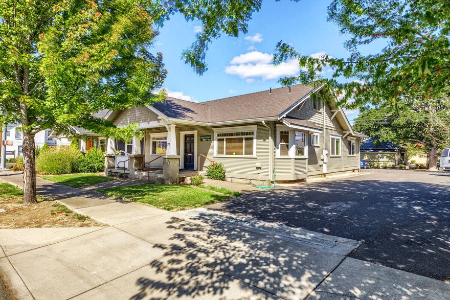 Inviting Craftsman cottage office space in a terrific Medford location. Located just a block from Jackson County Public Health and Medford City Municipal Court and a few blocks from Main St and Rogue Community College, this office presents many uses/opportunities. The ADA compliant building has it's own parking lot with nine spaces and alley access. A large front porch welcomes clients into the offices that has a built-in reception desk. Four private offices along with a conference room allows for flexibility and even shared workspace if desired. A kitchenette and bathroom round out the space. There is also upstairs storage space if needed. In area with other well-cared for offices, this office building will serve a variety of businesses, providing wonderful accessibility and visibility.