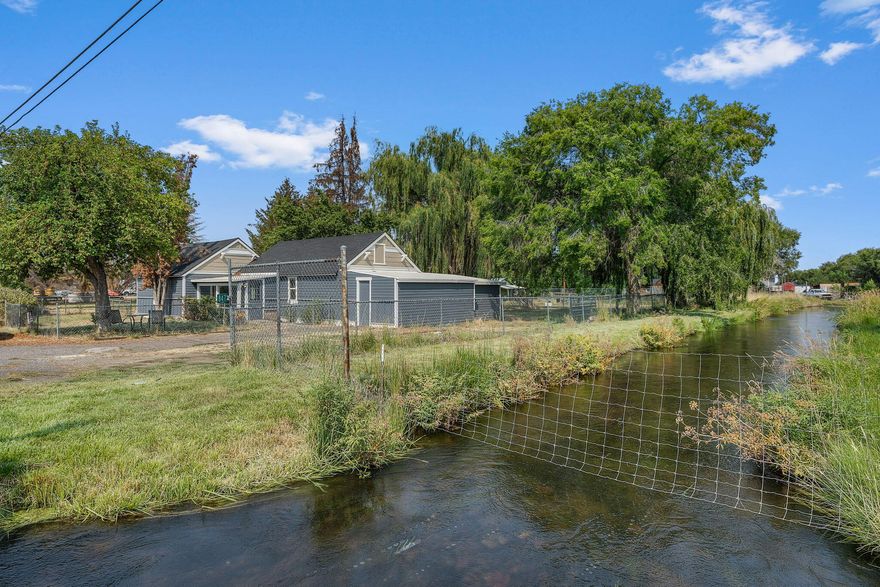 Fully remodeled and move-in ready, this 2 bed, 1 bath, 1,092 sq ft home is located in the heart of the Terrebonne Commercial District and zoned Commercial—ideal for live/work or investment potential. Recent upgrades include a new roof, siding, windows, a fully renovated kitchen, and a stylish tile shower with glass doors. Features laminate flooring, a sunroom, laundry room, walk-in closet, and efficient ductless heating/cooling. There are .41-acre of irrigation water rights and a large RV shop. A rare opportunity with both residential comfort and commercial flexibility!