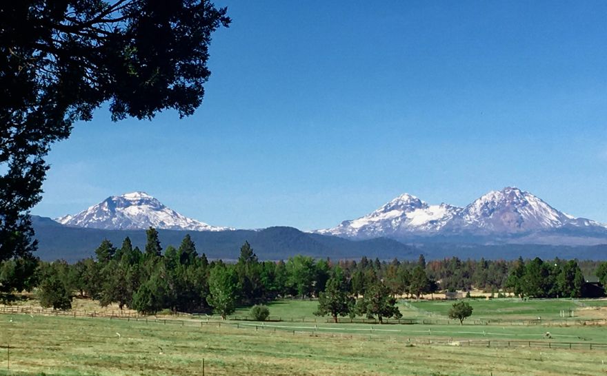 HUGE VIEWS abound from this incredibly private 37-acre Tumalo ranch, just ten minutes to Bend! Bring your horses, mountain bikes, and hiking boots to this one-of-a-kind property with deeded access to Forest lands for endless fun right from your back door! Stunning views from Broken Top to Mt. Jefferson tower over hay fields and forests with meandering canals. This ranch has 28.6 acres of underground irrigation controlled remotely via the web. There is solar fencing for horses, round pen and ample areas to realize your visions for an equestrian facility... or a landing strip for your airplane! The beautifully updated home has timber beams, marble counters, privacy and room for all of your toys in the 8-car garage. Working remotely? You will love your separate 250 sq ft office and an additional bonus room has possibilities for an in-law suite or home gym. Watch awesome sunsets and endless wildlife from this serene Tumalo retreat, just minutes from everything that Bend has to offer!
