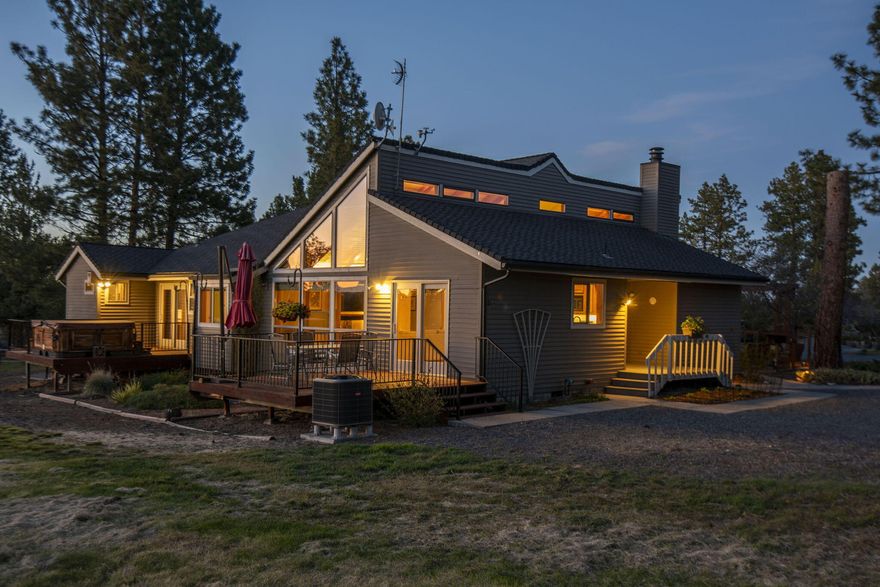 Escape to your own slice of paradise in this captivating property nestled on a sprawling 8.59 acres 15 minutes from downtown Bend. This beautifully crafted home offers the perfect blend of privacy, stunning natural beauty, and functional living space. The home's single-level design fosters a sense of ease and accessibility. Step inside and be greeted by soaring vaulted ceilings that let in natural light and frame the Cascade Views to the west. The master suite provides a tranquil retreat, while the additional bedrooms offer space for guests or family. A fully finished 1-bedroom, 1-bathroom daylight basement apartment with a separate entrance offers versatility as a guest suite,
home office, multi-generational space, or studio. The property includes 4 dedicated acres of irrigation rights, the possibilities are endless. Enjoy the friut trees, raise animals or just enjoy the expanisve grounds. A large RV garage/workshop with flex space provides ample storage and space for your hobbies.