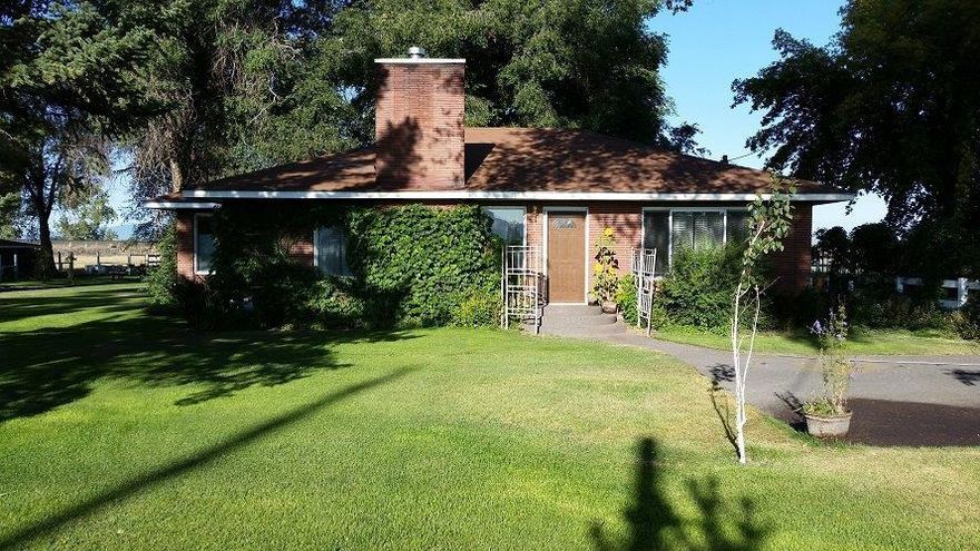 PRICE REDUCTION TO $295,000--- Great 14 acre Historic Henley Ranch that was settled in the 1800's. This property has been organically maintained but not certified, has a 2 bed 1 bath home with wood floors, arched doorway and coved ceilings. There is a gas fireplace, built in china hutch and bookcase. There are mature trees in yard, large garden area, fire pit and in ground sprinklers. Plus a shop, detached garage and pole barn with original barn boards including tack room, stalls & feed troughs, hayloft, windows and electricity. The property has KID A water, gated pipe and great soils. The sellers have grazed and grown hay on the property. There is a seasonal pond that is just off property but within the fence line. Property is fenced and cross fenced plus a new crossing with gates off Henley Road. Kids can literally walk to desirable Henley Schools!!