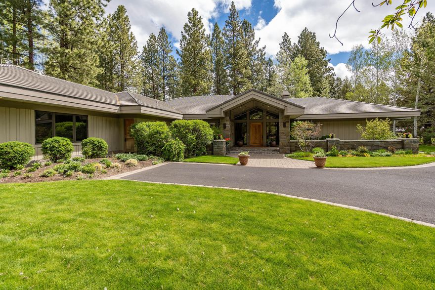 Elegant single level home situated on an oversized double lot along Broken Top's 4th Fairway.  Vaulted ceilings and floor to ceiling windows allow natural light to flood the interiors and accentuate the clean contemporary lines of the flowing floorplan. A sense of light and space prevails throughout the interiors beginning w/ the welcoming great room overlooking the golf course views and warmed by a wood burning fireplace. An incredible kitchen and charming breakfast nook open to the expansive paver patio perfect for el fresco dining & entertaining.  The formal dining room is a focal point of the home w/ a wall of windows overlooking a private courtyard and garden. The primary suite is a retreat unto itself w/ golf course views, lovely bath w/ soaking tub & an enormous walk-in closet.  The spacious golf course view office is nearby and two elegant full en-suite guest rooms are situated in separate wing of the home, providing the ultimate privacy. Separate driveway leads to 3-car garage