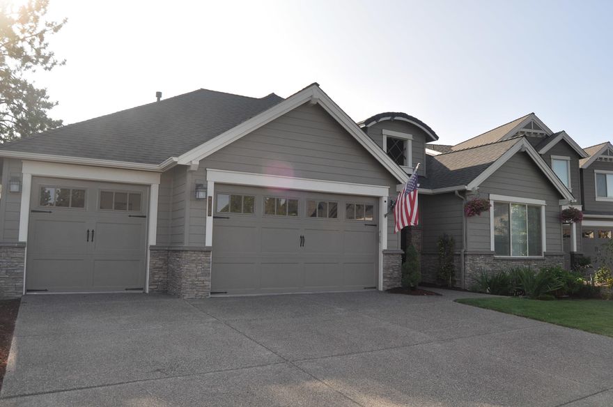 Lovely single level home from Pahlisch Homes features a grand entryway with archway, coffered ceiling & wood floors. Step into the dramatic vaulted great room with stone fireplace, skylights & large windows. You'll love the roomy kitchen with quartz counters, 5-burner range, stainless steel appliances. Master suite w/tile shower,tub & huge walk-in closet. Plus a 3-car garage! Amazing community amenities, resort-style living in Bend!