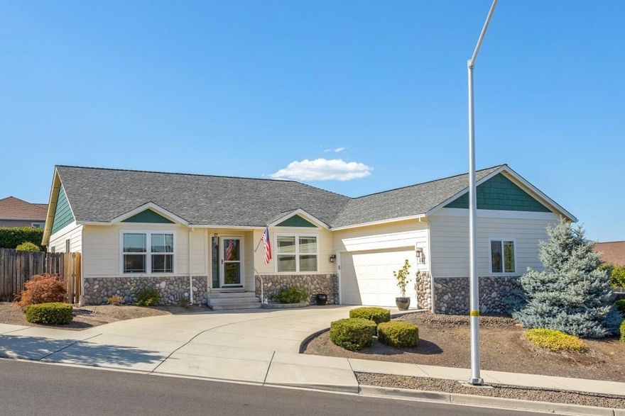 Come enjoy this 3 bedroom 2 bath home with an office in lovely Eagle Point. This home features a split floor plan with the master separate from the guest rooms. The office is just off the front entry and nicely spacious. Extensive hardwood floors grace the living room, kitchen, entry and high traffic areas. The kitchen features stainless appliances, gas range/oven and a large walk-in pantry. Living room has 9 ft. ceiling, crown molding and gas fireplace. Master boasts vaulted ceiling with accent lighting, double vanity, soaking tub and walk-in closet. Outside is a very low maintenance yard with drip irrigation and a raised garden bed. This home is located in a wonderful area of Eagle Point short distances to schools, shopping and parks. Seller is providing a 1 year home warranty.