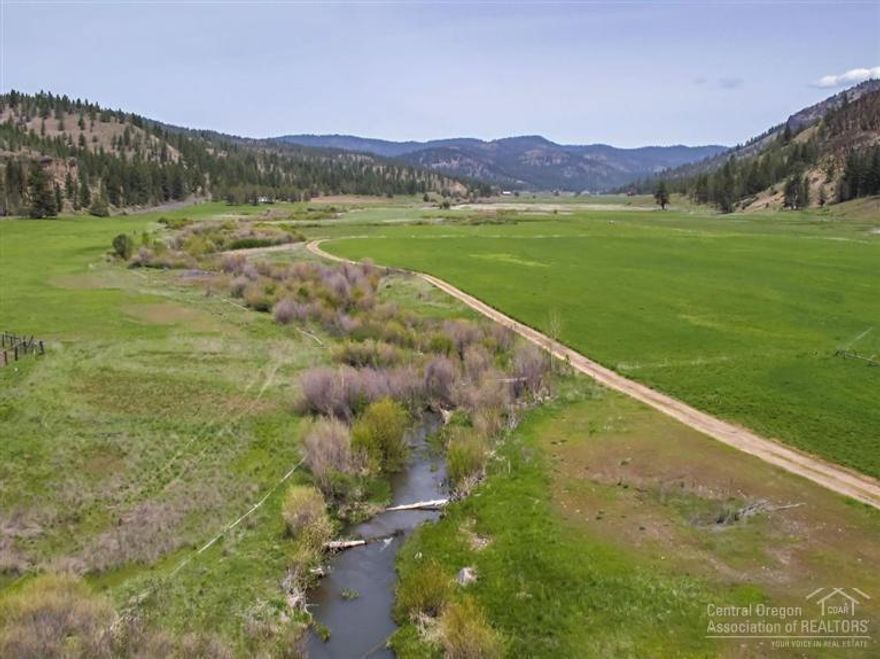 Mountain Springs Ranch in Beautiful Mill Creek Valley. 1956 acres w/ a mile of Mill Creek, including 90 acres of water rights to irrigate pastures for hay production, valley meadows & wetlands for bird hunting & fishing. The ranch has varied topography w/seasonal mountain springs, streams, ponds, timber & wildlife. Views of Cascade Mtns, Ochoco Reservoir & Mill Creek Valley. Improvements include: updated 1596 sf 2 bed, 1 bath home overlooking creek, barn, shop, corrals, farm dwelling & potential home site.