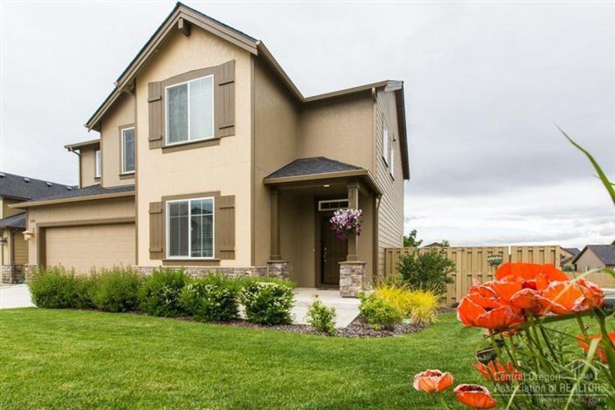 Enjoy peek-a-boo mountain views, raised garden beds and a spacious deck for all your entertaining needs. With 3 bedrooms and 2.5 baths, an office/den on the lower level and bonus room on the 2nd level, this home features wonderful living space with room for all. Great room w/ custom built ins and a gas fireplace. Kitchen features upgraded cabinets, stainless steel appliances,tile counters & pantry. Double doors lead into the master bedroom, spacious master bath w/soaking tub & separate walk-in shower.