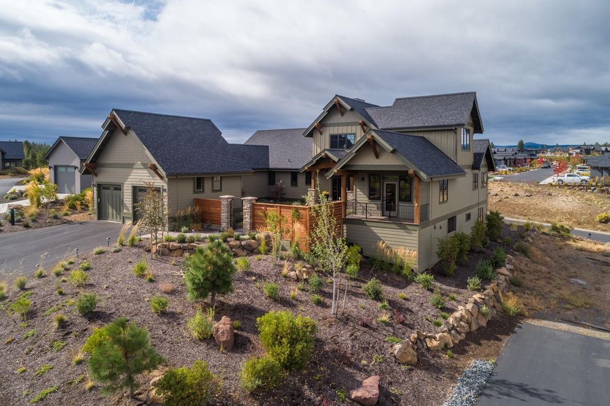 Refined lodge style home in Tetherow w/ beautiful Cascade mountain views! Executive home w/ mostly main level living exudes a casual elegance. Perfect blend of quality craftsmanship & thoughtful design. Gated courtyard entry. Impressive great room w/ 25' ceilings & stacked stone fireplace. Kitchen w/thoughtful French Farmhouse touches of exposed brick walls, beamed ceiling, custom covered range hood & copper sink. Huge 
Quartzite island. SS apps, gas range w/ 2nd oven & warming oven, huge pantry & customized drawers & cabinetry. Covered deck w/gas BBQ. Large master w/natural light & private deck. Luxurious master bath w/ quartz counters, large tiled shower w/double heads, jetted soaker tub, heated tile floors & two separate walk-in closets. Main floor w/2nd bedroom that doubles nicely as a large office, huge laundry & access to the 3 car garage. Loft overlooking the great room. Downstairs 3rd bed & full bath. Adjacent to accessible parkland w/numerous trails. Large .40 acre view lot.