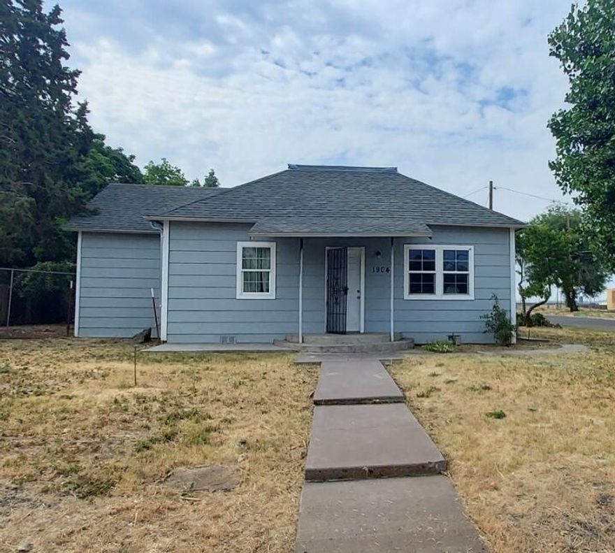 This charming two bedroom, two and a half bath home is located on a corner lot. It has had many updates! Quality tile work in the kitchen and bathrooms and it has nice laminate in the living room. Kitchen has been updated with nice oak cabinets and tile countertops. There is a finished attic that has a lot of potential uses that adds approximately 225 sq. ft. to the home. Both bedrooms have their own bathroom plus it has a half bathroom! Forced air gas heat, tank-less gas water heater. Roof was replaced in 2015. It has vinyl windows, fenced side yard, detached garage and a large back deck.