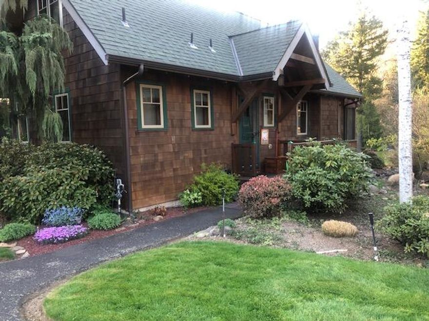 COMPS ONLY 
Perched on an elevated site, this custom log cabin steps down toward the famous McKenzie River. Inside, you'll find beautiful clear fir flooring, fir cabinetry,  windows and doors, with pine walls throughout that add warmth and character.
The main level features vaulted ceilings and an open-concept layout that seamlessly connects the kitchen, dining area and great room with river rock gas fireplace. French doors leading to a screened-in back porch offering an unobstructed view of the wide greenway stretching to the river's edge. An ensuite bedroom and bath complete the main floor.
Upstairs, a cozy carpeted bedroom and full bath provide a quiet retreat, with a high story window framing a scenic view of the river.
A detached one-car garage sits just across from the cabin's entrance. Ideally located, this getaway is only a short drive to whitewater rafting, the Tokatee Golf Resort, miles of hiking, mountain biking and world class fly fishing.