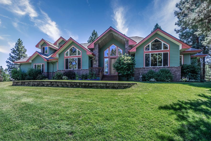 Investment opportunity knocks w/ this small acreage property oasis in NW Bend. This fully fenced, gated & completely landscaped property offers it all w/ gorgeous gardens, meandering streams, huge pond stocked w/ koi & a private dock. True peace & serenity is the feeling you'll get while relaxing beside the water, or entertaining on your front & back patios. This custom built home offers several desirable upgrades, such as massive vaulted ceilings, expansive views onto your stunning & private property, hardwood flooring, an open kitchen w/granite slab counters, SS appl's, wood doors & trim, surround sound, air & much more! Downstairs offers mstr on the main, along with an add'l en suite, which doubles as a great at home office. Upstairs features a spacious & open loft, along w/2 add'l BD & full BA. Property is w/in min to Downtown Bend & just up the road from Sawyer Park, Tumalo State Park, the Deschutes River & is just blocks to the 184 acre Riley Reserve Ranch. Subdividable property!