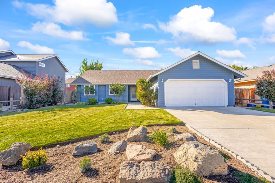 Light and bright single level living in NW Redmond with brand new roof! This floor plan offers an open great room with large kitchen and spacious dining/bonus areas. Kitchen counter seats 5+...a perfect entertaining space.  You'll love the amount of natural light from all of the windows! Mud/laundry room off of garage provides ample storage space for shoes, snow gear, and more - with a window to the front entry, could even be a small office or crafting space. Two bedrooms at the front of the home have deep boxed windows that bring so much character inside and out. Primary bedroom sits at the back of the home. Primary en suite has 2 closets and walk-in shower. Outside patio is south facing - lots of sun all year long! Beautiful and simple landscaping is ready for you to enjoy. Fabulously located just 2 blocks from the new Dry Canyon Club and less than 1/2 mile from the Dry Canyon trailhead at Canyon Rim Park!