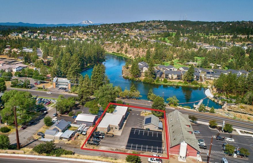 Two high quality office buildings which are currently fully NNN leased to established Bend businesses through 2025, and includes one residential apartment. These recently updated/remodeled buildings are conveniently located near Bend Parkway access and downtown Bend, and enjoy a beautiful unobstructed view of the Deschutes River. 
Additional features include modern interior finishes, solar electric panels, ductless heat pumps, and generous paved off street parking. 
This CL zoned investment property and/or future owner/user opportunity also features great visibility from NE Division Street. Property is located in an Opportunity Zone.