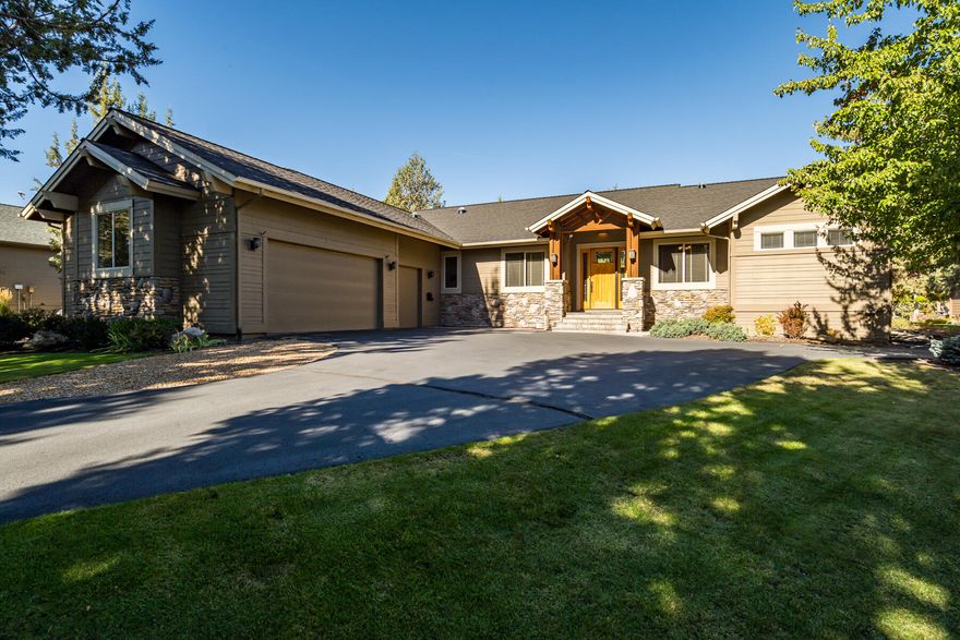 Set on over a half acre in the desirable Eagle Crest Resort community, this immaculate Craftsman-style home combines luxury, comfort, and a park-like setting. Overlooking the 2nd fairway of the Ridge Course, it features hardwood floors, vaulted ceilings, and large windows framing stunning golf course views. The chef's kitchen offers double islands, gas cooktop, wall oven, breakfast bar, and pantry—perfect for entertaining. The great room highlights wood beams, stone fireplace, and custom built-ins. The primary suite includes patio access and a spa-like bath with soaking tub, walk-in shower, and dual vanities. Two guest bedrooms share a connecting bath, plus an office and spacious laundry room. Beautifully landscaped grounds, abundant natural light, and an oversized triple garage complete this peaceful resort retreat. NEW ROOF COMING NOV 2025!