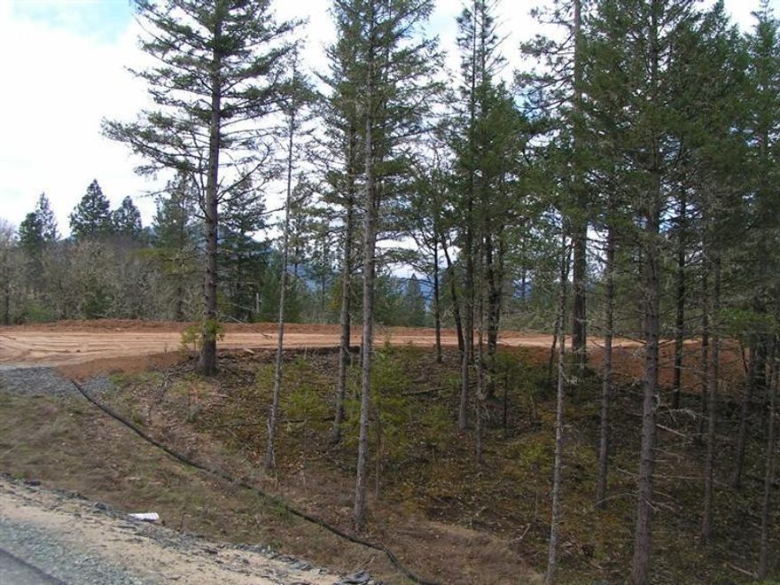 WOODED FIVE ACRES With Developed Building Pad Easy Access, Corner Lot, North Property Line is fenced. Located in an area of Quality Homes. Minimum 2000 s/f. Ready for your Building Project. Well is 7 gpm.[When Drilled] Septic Approval is Standard with Soil Cap. One Seller is an Oregon Licensed Real Estate Broker. All Information is deemed to be reliable, but not guaranteed, and is subject to change.