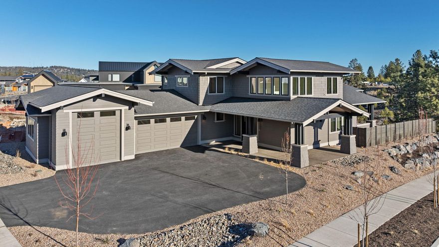 Located on a corner lot that backs up to the 40-acre Discovery Park, this Modern Craftsman home has a light-filled, open layout ideal for living the active Bend lifestyle. The welcoming great room has a gas fireplace and floor-to-ceiling windows overlooking a large patio—which has a built-in gas fire pit—and the park beyond. A designer kitchen has a center island with seating and large butler pantry with storage, prep area and sink. The main-level primary suite has patio access, a walk-in shower, soaking tub and large walk-in closet, and a main-level study has natural light. Upstairs, there is a secondary suite, third bedroom, third full bath and flex space. This well-designed home connects the spacious garage—which has a third bay with a 10' overhead door, ideal for an adventure vehicle—with the living area via a laundry/mud room. Convenient to trails, parks and westside amenities, including NorthWest Crossing and The Grove, this home provides outdoor access and a sense of community.