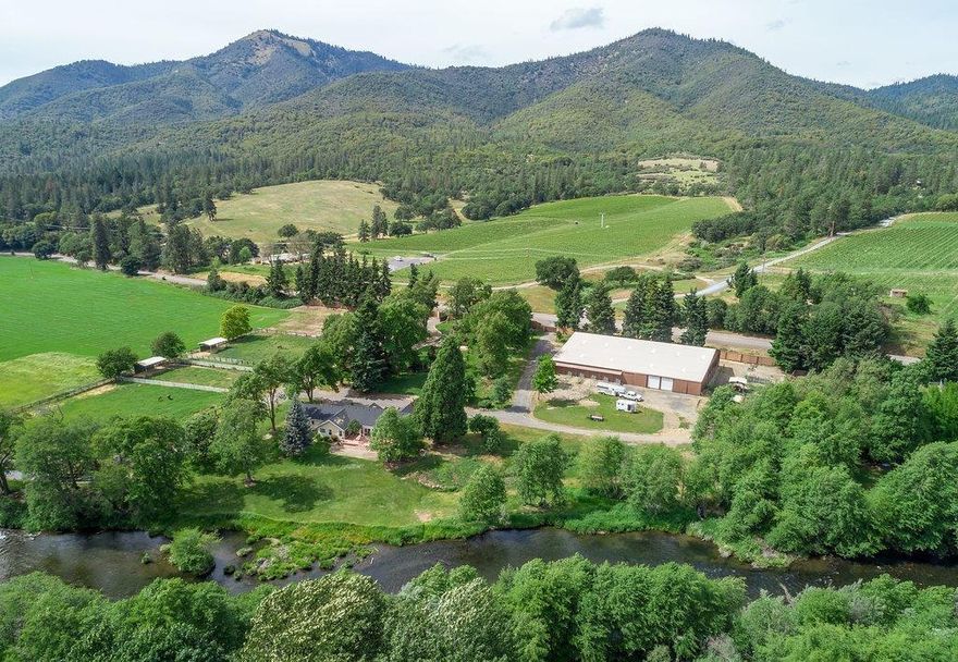 2000 ft of pristine Applegate River Frontage w/ exceptional steelhead & trout fishing. 45 Acre Equestrian Farm, approx 30 Irrigated Acres & 2 Homes. 10 Miles from Historic Jacksonville. The farm is located in the highly desirable Applegate Valley surrounded by Vineyards and many wineries. 2 amazing barns, over 10,000 sq ft indoor riding arena, stalls paddocks, tack rm, wash station, shops, hay equipment barn and shop! Main home is a Ranch style over looking the River w/ nice updates, vaulted great rm, tile & laminate floors, 3 bdrms, 3 baths + office & sunroom, 2496 sq ft. Second Home is 2 bdrm, 2.5 baths, 2035 sq ft & is all new 2016 w/ upscale amenities. Park like grounds & walk ways. 2 gated entries, fenced & cross fenced & riding paths along the river & farm.