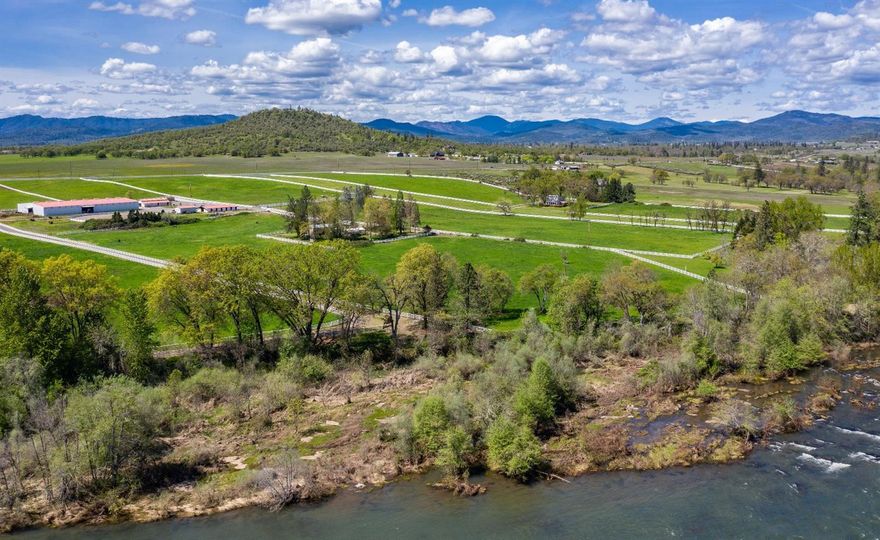 Welcome to Sutton on the Rogues' Horse Ranch Property. This riverfront lot includes beautiful irrigated pastures, phenomenal horse facilities, a dedicated paved entrance and a 2,400 Sq. Ft. home. The enclosed riding arena is approximately twenty-five thousand square feet and has lighting, sprinklers and sound system. The main barn features eight stalls, tack room and two wash racks. The Guest'' barn features 12 stalls and is perfect for clinic guests or boarding. Great, 160 ft round pen with good footing and solid walls. 1,000+ Sq. Ft. equipment and storage building. There are 4 pastures for grazing horses or other livestock on the horse property, totaling 16 acres. This property is located a mere 15 minutes from the conveniences of Medford and the Rogue Valley International Airport.