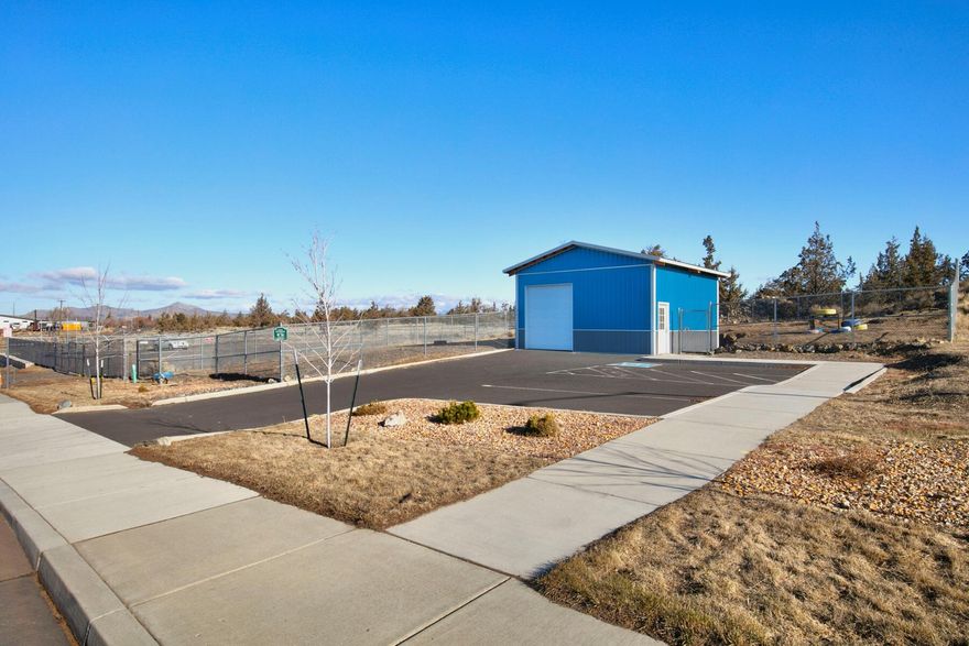 This investment opportunity presents a unique property located in an M-2 Industrial Zone, allowing for a wide range of industrial uses. The property features a 576 sq. ft. building with chain-link fencing and 3 asphalt parking spaces, including handicap access. All city approvals and landscaping requirements have been met. City water and sewer are readily available on-site, with an 8'' City main line located on 4th Ct. South of Lake Rd. The M-2 zoning provides flexibility for future development, such as expanding the existing dog park or pursuing other compatible industrial uses. This property offers strong potential for investors seeking a versatile opportunity.