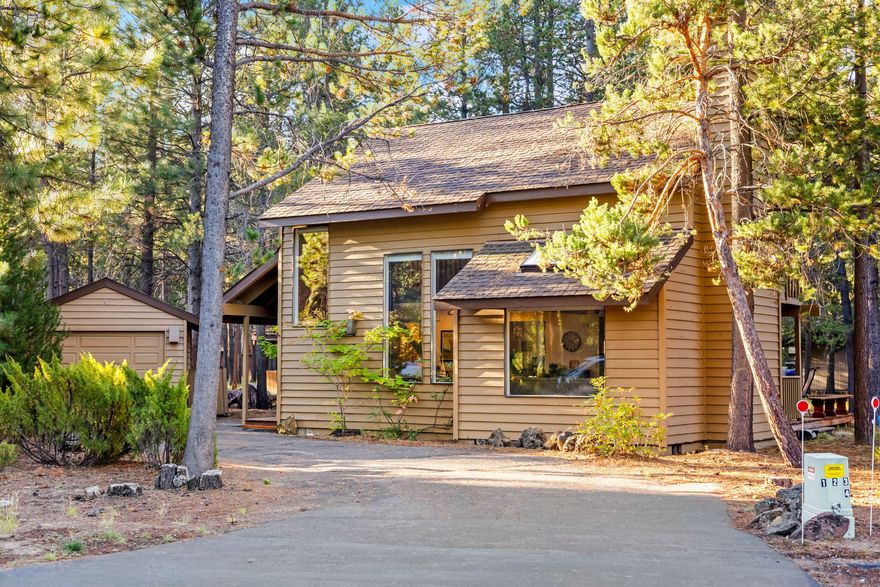 Experience the classic cozy charm of a true ''cabin retreat'' in the woods! This inviting 2-bedroom, 2-bath home sits in the heart of Sunriver, just minutes from SHARC, the Village, the Lodge, Marina, stables, and Fort Rock Park. Step inside and be welcomed by the timeless Sunriver vibe - a crackling wood-burning fireplace, cozy wood-paneled walls, and sunlight streaming through skylights and a dramatic two-story wall of windows overlooking majestic ponderosa pines.
Unwind on the deck, enjoy a soak in the private hot tub, grill outside all year on the covered portion of the deck, or sip morning coffee on the upstairs balcony. The detached single-car garage adds convenience, and the home backs to a peaceful common area for extra privacy.
Already an established rental with future bookings in place, this is an opportunity to step right into your own Sunriver getaway!