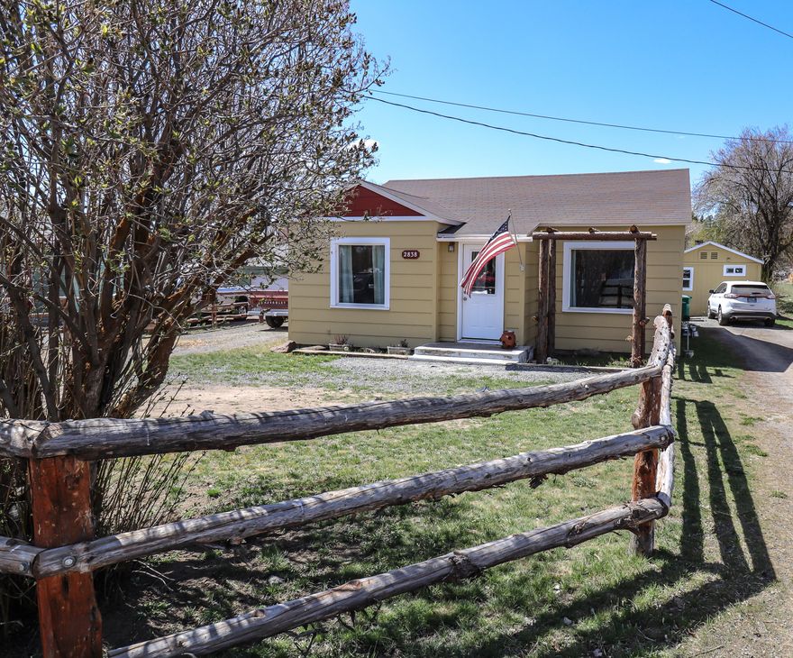 Cute, clean, and ready for you to move in! This adorable 2 bed/1 bath cottage is situated on almost half an acre and boasts newer vinyl windows, updated electrical, and easy to clean laminate flooring. This home feels much larger than its square footage suggests with a super user friendly floorplan and plenty of natural light. The back yard is fenced and would be great for entertaining, back yard BBQs,  or 4H animals! Situated just behind the main home is an incredibly inviting, studio style, additional living space with its own full bathroom.  Great for multigenerational living or hosting out of town guests!