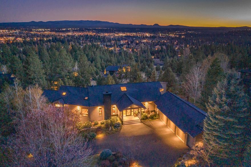 One of a kind views of Bend, OR steal the show at this extensively remodeled, contemporary home. The glass front door is a wow factor as you walk in to the views & the Old Mill framed in the wall of windows. You feel big city style from the sleek fireplace to the walnut wet bar in the living room leading to a sitting area surrounded by glass. Endorsed by a former French Food & Wine Editor of Gourmet Magazine, the kitchen has the perfect flow of space & storage, gorgeous walnut cabinetry, soap stone counters & butcher block island. The master suite features a cozy office &  luxury bath with 2 vanities & closets, radiant heat, air jetted tub & tile shower. Main floor living keeps life easy with the master suite, 2 offices, casual & formal dining, kitchen & living; 2 bedrooms, full bath & a bonus room complete the lower level. Begin & end your day on the deck with 180 degree views of Bend and treetops forever. Buyer must be able to accommodate a Seller lease-back for up to a year.