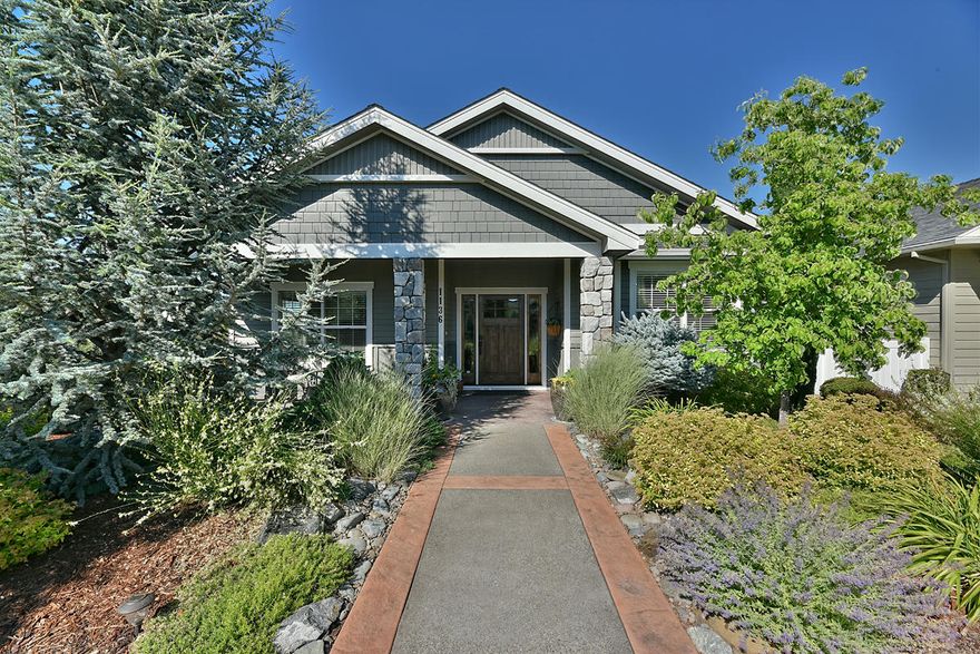 Stunning immaculate single level home located in the award winning Twin Creeks Subdivision! This custom Elite contemporary built home features upgrades throughout including 3 full bedrooms, 2 full baths with large master suite & bath w/ customized shower, vaulted ceilings, open kitchen w/ spacious 9' ceilings, glass tile backsplash, granite countertops, stainless steel appliances, 2 pantries, hardwood flooring, quality crafted cabinetry & trim package, custom rock gas fireplace w/ built ins, open living area, large two car garage, and more! This beautiful bright lovely home features professional mature low maintenance landscaping, patio w/ park like setting, all within walking distance to public parks, local schools and downtown Central Point!