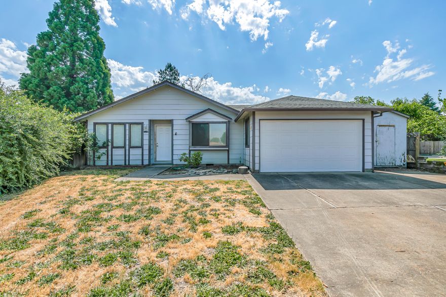 Tucked away in a peaceful Central Point cul-de-sac, this property offers tremendous potential in District 6. There's room for a small RV or boat beside the driveway, plus a front shed for added storage. The oversized single-car garage includes built-in cabinets. Inside, you'll find vaulted ceilings, laminate flooring, and a kitchen with two ceiling fans, ample cabinets, and included appliances—fridge, oven, and dishwasher. The layout features both a living room and a step-down family room, offering flexibility. The primary suite is spacious with vaulted ceilings, bay window, closet, sink with extra cabinets, and a walk-in shower. The backyard is huge with mature landscaping, a large side yard, and a stunning giant sequoia tree as a focal point. There's also a covered deck and outdoor area perfect for relaxing or entertaining. Great value and space with tons of upside in a desirable location.