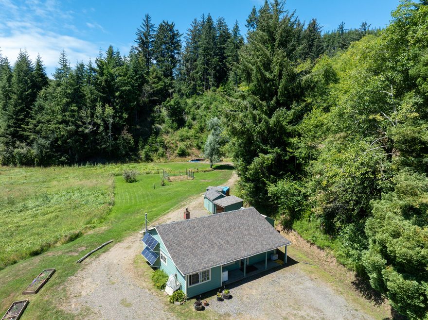 Enjoy this coastal retreat just outside of Newport and Toledo. Hidden Valley Cabin is 35+ acres of lush creek bottom/wetlands with some large timber surrounding the property's own valley. The 816± sq. ft. cabin was stripped down to the studs and renovated in 2021/22, including new siding, roofing, windows and paint. The new cabinets and doors are made of reclaimed wood to add character. The cabin is powered via solar system, heated by wood stove, and water is sourced by spring(pressurized by pump). Additionally, there is 4 sheds for equipment and firewood, small fenced garden, and a large redwood tree! Although the cabin sits in a flood plain there is elevated sites for possible replacement dwellings(buyer to verify with county planning). If you are looking for private retreat backing up to private timberlands this could be it. Hidden Valley is 20 mins from Newport, 11 mins Toledo, and 18 mins from Yaquina Bay. As the crow flies the property is less than mile from Yaquina Bay.