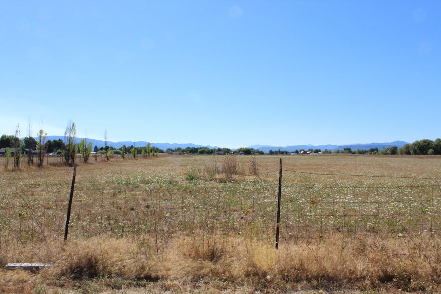 EFU, all flat and fenced with good well. No homesite approval. Buyers to do own due diligence.