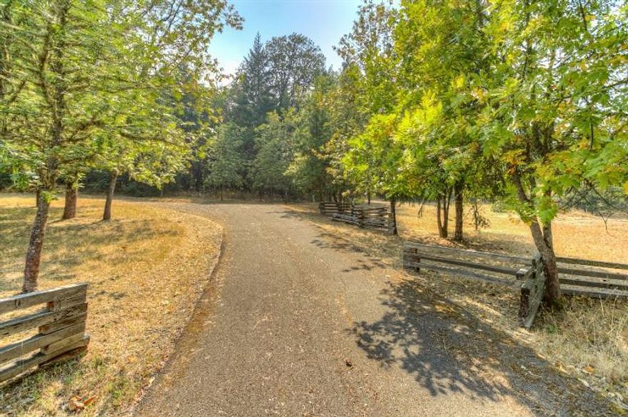 Beautiful home-site to build your dream home in the Dark Hollow Country Estates with electric gated entry, paved road all the way to the property. Underground utilities for phone, electricity & septic that is already in! Well is installed with pump (good water per seller). Gentle rolling with mixed tall pines & oak tress plus a seasonal creek on side of property. In a nice quite area of nice homes but very private & views of mountains & some valley & city lights. This is a prime country home site that has it all!! Close to Ashland, Jacksonville & Downtown Medford & some of Southern Oregon's best Winery's.