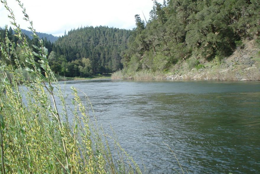 Wild & Scenic Rogue Riverfront Retreat in Beautiful Galice Oregon famous for Rafting, Boating, Fishing, ATV, Biking & Hiking Trails. Sit on the Deck Overlooking the River. Just relax & Watch the Deer, Osprey, Eagle & Plenty of Other Abundant Wildlife Go By! This Charming Bi-Level Home is 816 Square Feet per Assessor with 2 Bedrooms & 1 Bath along with an Additional 816 Square Foot Full Unfinished Basement Below. Properties Rarely go on the Market in the Galice Area. Great Location Just Past the Galice Resort & Boat Ramp. Property is on .39 Acre & has it's own Sandy Beach! Vacation Here or Live Full Time.