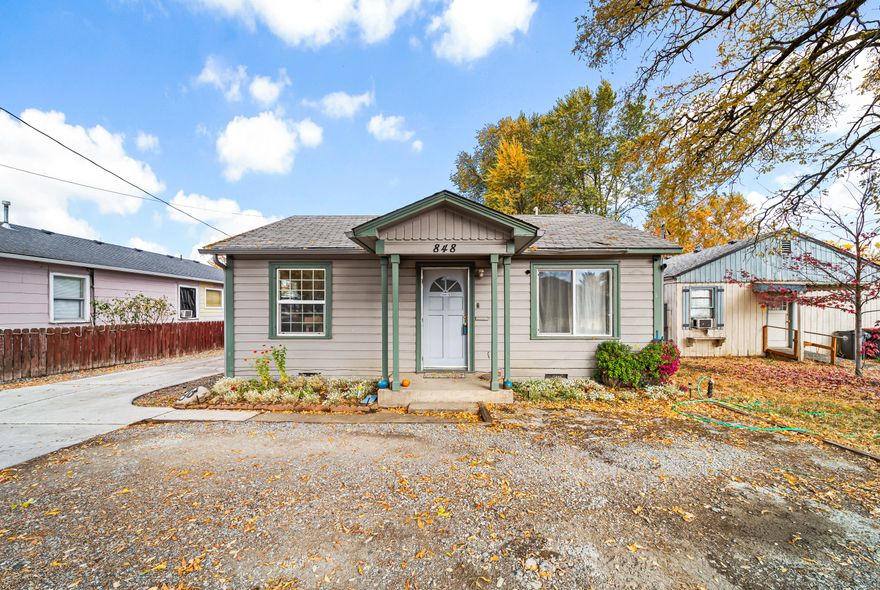 Cute and charming 2 bedroom/1 bath home conveniently located close to services and amenities. Perfect for investor, first time home buyer or anyone looking to downsize. Home offers hardwood and laminate floors in living room, kitchen and dining room, vinyl windows and an ungraded HVAC system with gas heat pump. New roof to be installed prior to close of escrow.  Kitchen includes an island an an abundance of cabinets for storage and newer appliances. Large laundry room with additional storage. A sliding door leads from the dining area to the covered patio and spacious, fenced backyard with garden beds that is perfect for entertaining. Plenty of off street parking with a detached garage. Make this affordable home yours!