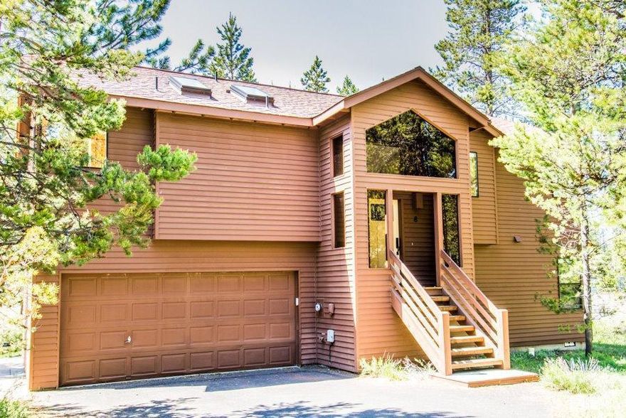 Light & bright updated home. Slate entry. Vaulted ceilings, skylights, hardwood floors, granite kitchen counter tops. Solid core wood doors throughout. Ceramic tile counters and floors. Brand new hot tub on large deck with views of the woods and distant bike path and tennis courts. Close to the Marketplace. Everything in the home has been updated in recent years. Enjoy the wood burning fireplace in the great room with French door access to deck. Master also has French doors leading to hot tub.